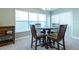 Bright dining room with glass-top table and four chairs at 591 Preserve Pointe Blvd, Davenport, FL 33837