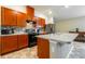 Updated kitchen with stainless steel appliances and wood cabinets at 591 Preserve Pointe Blvd, Davenport, FL 33837