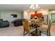 Open kitchen features a breakfast bar and stainless steel appliances at 591 Preserve Pointe Blvd, Davenport, FL 33837