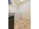 Laundry room with washer, dryer, and shelving at 591 Preserve Pointe Blvd, Davenport, FL 33837