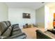 Living room with brown leather reclining sofas at 591 Preserve Pointe Blvd, Davenport, FL 33837