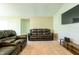 Living room features brown leather reclining sofas at 591 Preserve Pointe Blvd, Davenport, FL 33837