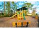 Community playground with playset, slide, and benches at 591 Preserve Pointe Blvd, Davenport, FL 33837