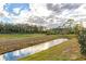 View of a pond or canal with lush greenery at 591 Preserve Pointe Blvd, Davenport, FL 33837