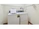 Laundry room with white washer and dryer at 6761 Trail Ridge Dr, Lakeland, FL 33813