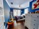 Bright bedroom featuring hardwood floors and ample closet space at 705 E Pine St, Orlando, FL 32801