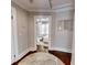 Main bedroom with hardwood floors and decorative wall art at 705 E Pine St, Orlando, FL 32801