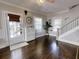Bright entryway with hardwood floors, white door and staircase at 705 E Pine St, Orlando, FL 32801