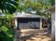 Detached garage with dark-colored doors and brick pavers at 705 E Pine St, Orlando, FL 32801