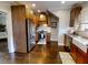 Modern kitchen with stainless steel appliances and wood cabinets at 705 E Pine St, Orlando, FL 32801