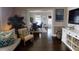 Living room with hardwood floors, white built-ins, and view to dining area at 705 E Pine St, Orlando, FL 32801