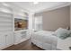 Bedroom with built-in shelving and window at 7321 Brightland St, Windermere, FL 34786
