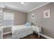 Bedroom with built-in shelving and window at 7321 Brightland St, Windermere, FL 34786