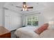 Bedroom with sliding door closet and hardwood floors at 7321 Brightland St, Windermere, FL 34786