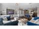Spacious living room with built-in shelving and a view into the kitchen at 7321 Brightland St, Windermere, FL 34786