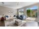 Relaxing living room with sliding doors leading to a private patio at 7321 Brightland St, Windermere, FL 34786