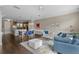 Open living room showcasing a comfy sectional sofa and hardwood floors at 7321 Brightland St, Windermere, FL 34786