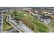Aerial view of community entrance and golf course at 856 Driving Range Ct, Reunion, FL 34747
