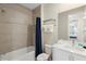 Clean bathroom with shower/tub and white vanity at 856 Driving Range Ct, Reunion, FL 34747