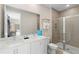 Spa-like bathroom with double vanity and walk-in shower at 856 Driving Range Ct, Reunion, FL 34747