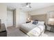 Bright bedroom with king-size bed and closet at 856 Driving Range Ct, Reunion, FL 34747
