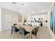 Elegant dining room with a large table and modern chandelier at 856 Driving Range Ct, Reunion, FL 34747