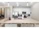Modern kitchen features stainless steel appliances and white cabinetry at 856 Driving Range Ct, Reunion, FL 34747