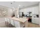 Modern kitchen with stainless steel appliances and breakfast bar at 856 Driving Range Ct, Reunion, FL 34747