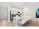 Modern kitchen with stainless steel appliances and an island at 856 Driving Range Ct, Reunion, FL 34747