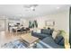 Open concept living room and kitchen with modern decor at 856 Driving Range Ct, Reunion, FL 34747