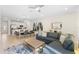 Spacious living area with sectional sofa and view into dining area at 856 Driving Range Ct, Reunion, FL 34747