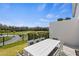 Patio with table and chairs and golf course view at 856 Driving Range Ct, Reunion, FL 34747