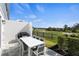 Outdoor patio with table and chairs, golf course view at 856 Driving Range Ct, Reunion, FL 34747