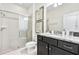 Bathroom with shower and granite vanity at 8921 Sydney Ave, Kissimmee, FL 34747