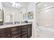 Bathroom with tub and double vanity at 8921 Sydney Ave, Kissimmee, FL 34747