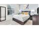Bedroom with a full bed and window at 8921 Sydney Ave, Kissimmee, FL 34747