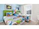bedroom with twin beds and dinosaur theme at 8921 Sydney Ave, Kissimmee, FL 34747