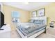 Bedroom with a king-size bed and window at 8921 Sydney Ave, Kissimmee, FL 34747