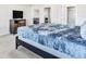 Spacious bedroom with a large bed and TV at 8921 Sydney Ave, Kissimmee, FL 34747