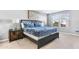 Spacious bedroom with a comfy bed, nightstands, and plenty of natural light at 8921 Sydney Ave, Kissimmee, FL 34747