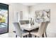 Dining room with marble top table and gray chairs, overlooking the pool at 8921 Sydney Ave, Kissimmee, FL 34747