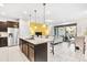 Open kitchen with large island, stainless steel appliances, and granite countertops at 8921 Sydney Ave, Kissimmee, FL 34747