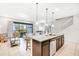 Open concept kitchen with granite island and stainless steel appliances at 8921 Sydney Ave, Kissimmee, FL 34747