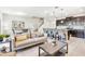 Open living room and kitchen with neutral colors and plenty of natural light at 8921 Sydney Ave, Kissimmee, FL 34747