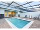 Private pool and patio with lounge chairs and seating area at 8921 Sydney Ave, Kissimmee, FL 34747