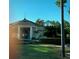 Community clubhouse with circular design and landscaping at 9111 Woodbridge Oak Ter, Orlando, FL 32825