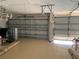 Two-car garage with open doors and ample space at 9111 Woodbridge Oak Ter, Orlando, FL 32825