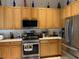 Well-equipped kitchen with stainless steel appliances and ample cabinetry at 9111 Woodbridge Oak Ter, Orlando, FL 32825