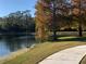 Scenic walking path alongside a tranquil lake at 9111 Woodbridge Oak Ter, Orlando, FL 32825