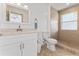 Clean bathroom with a step-in shower and white vanity at 100 Palermo St, Davenport, FL 33897